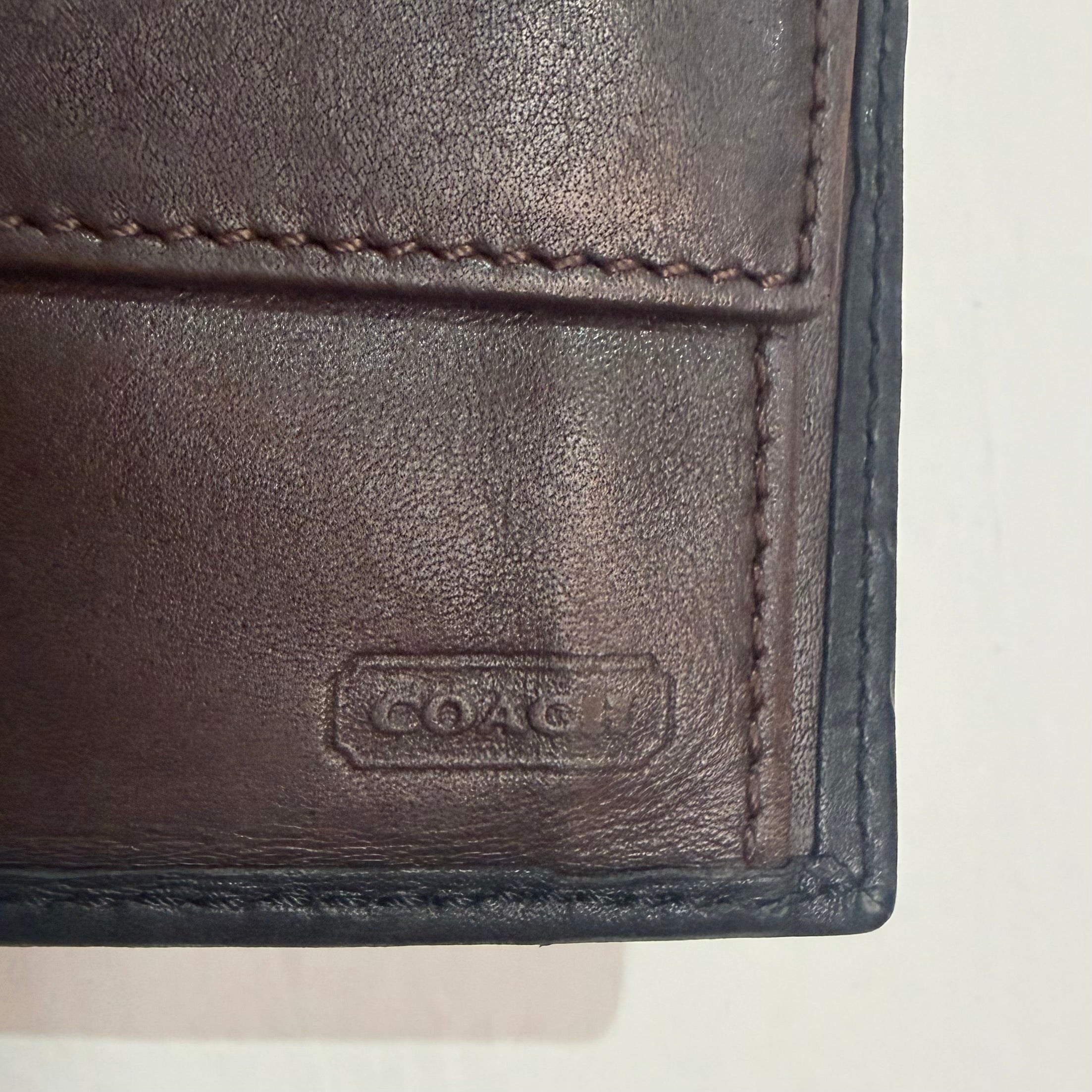 Cartera coach de piel
